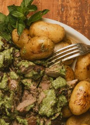 Greek roast leg of lamb with potatoes and fresh herb sauce